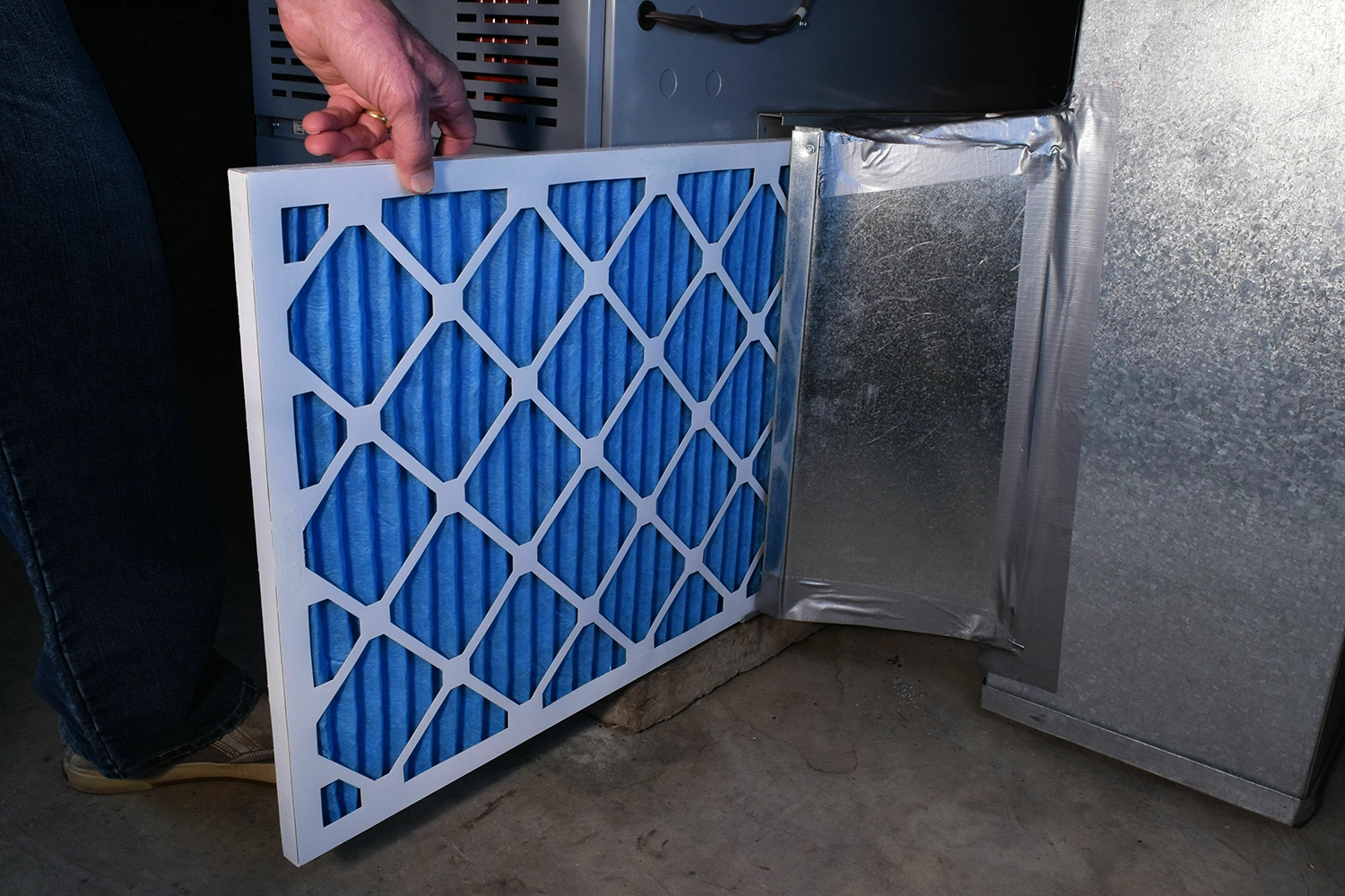 Clean furnace filter next to HVAC equipment — Sub Zero Temp Control